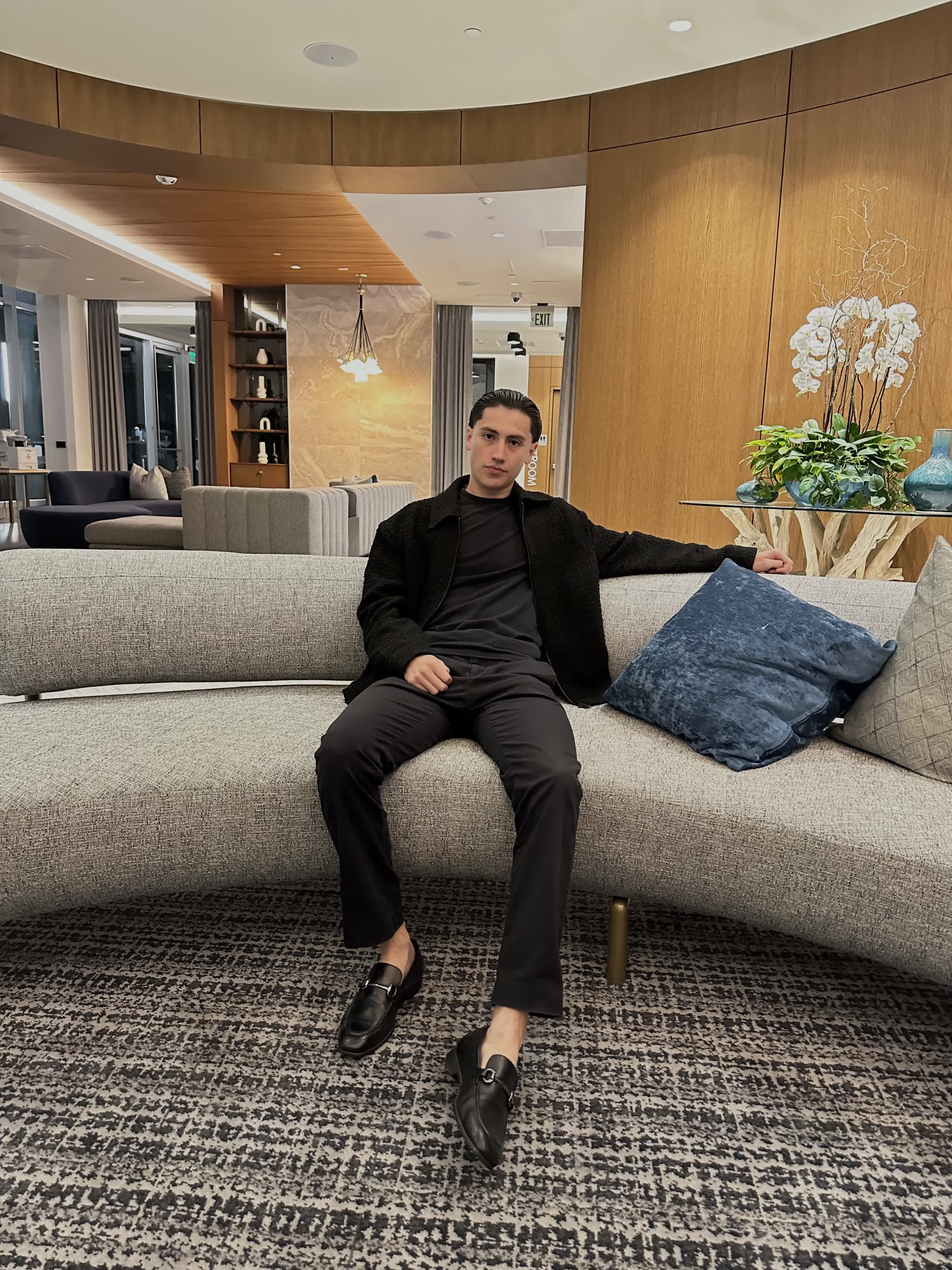 Emilio Hurtado seated in a contemporary interior